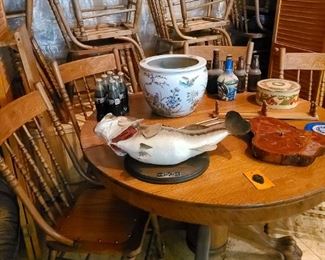  Antique oak pedestal table with claw feet, Antique spindle back chairs. Super collectible singing fish, no camp is complete without one. 
