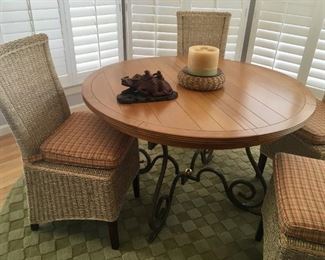 48" round dining table by Creative Metal & Wood. 4 side chairs, hemp rope with cushions.