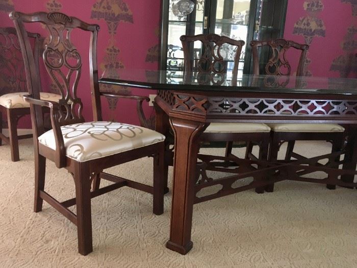 Beveled octagon glass-topped, b dining room table with Chinese Chippendale base, 79" x 45.5".  Art Nouveau chairs with upholstered seats: 4 side and 2 arm.