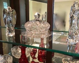 Baccarat angel. Bohemian etched glass decanter and glasses (lower shelf). Waterford, Tiffany crystal. Royal Doulton Reflections "Flirtation" figurine modeled by Adrian Hughes, 1985.