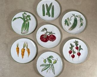 (7pc) FAIENCE VEGETABLE PLATES | Italian, each one painted and incised decorated with a different green vegetable; dia. 8 in. 
