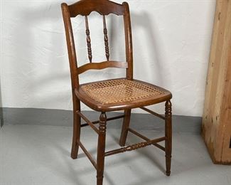 CANED SIDE CHAIR | Having a nicely figured crest rail over turned column backsplat, with caned seat; h. 32-1/4 x w. 16-1/4 x d. 15 in.; seat h. 17-1/2 in. 
