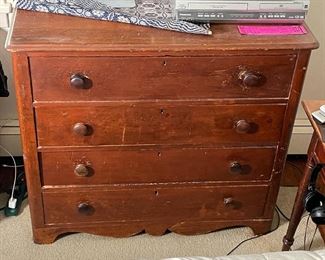COUNTRY CHEST of DRAWERS | Probably pine, having four full-width drawers with wood pulls, with cigar box joinery and sculpted apron; h. 35 x w. 38-1/2 x d. 17 in. 