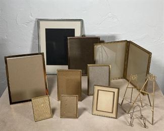GROUP BRASS & OTHER FRAMES | Brass and other metal frames of varying sizes and shapes, most with easel backs, plus 3 little easels/stands; largest 14-1/4 x 11-1/2 in. 