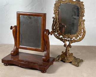 (2pc) DRESSING MIRRORS | Including one of nicely figured mahogany with curved sides on sculpted base (h. 13 x w. 12 in.), the other having a composite frame and stand of acanthus leaf and shell design (h. 16-1/4 in.) 