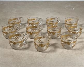 SET GOLD ETCHED PUNCH CUPS | A set of 11 glass punch cups decorated with gold scrollwork; w. 4 in. 