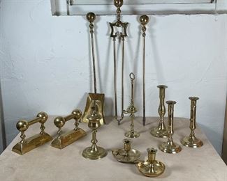LARGE GROUP BRASS ITEMS | Including push-up candlesticks, two lamp bases, plus fireplace equipment, etc. 