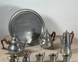 COLLECTION MISC. PEWTER | Including a set of 3 Reed & Barton Centennial pewter pitchers, a round Premier peweter tray (dia. 16-1/4 in.), and 5 Williamsberg Stieff pewter items, including 2 teapots and a coffee pot with wood handles, a creamer, and sugar 