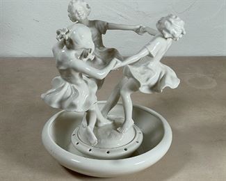 HUTSCHENREUTHER CENTER PIECE | Lorenz Hutschenreuther white porcelain center piece showing children at play, of two piece construction and in excellent condition; overall h. 10-1/2 x dia. 10 in. 