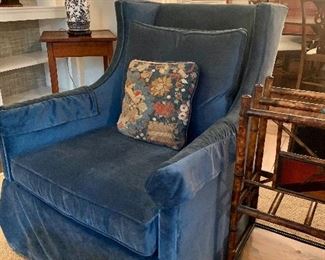 Velvet skirted swivel armchair