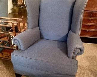 Wing back armchair with nail head trim