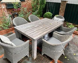 Kingsley Bate outdoor furniture.  Teak table and 6 chairs.  Includes cushions.
