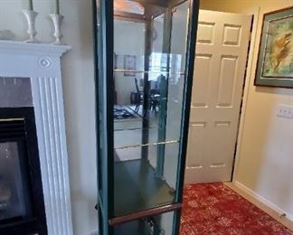 Lighted green painted curio cabinet