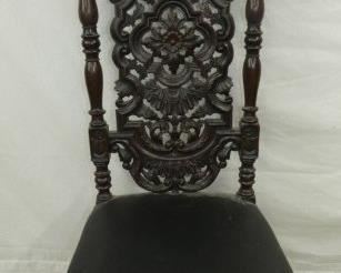 HEAVILY CARVED CHAIR