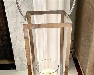 $38.00 each, two available, metal lantern with glass candle holder and large handle, could be hung or used on floor or centerpiece, 8” square x 32” high