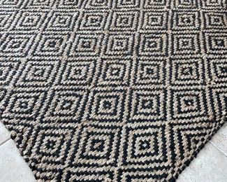 $300, black and tan modern jute rug 8’x10’