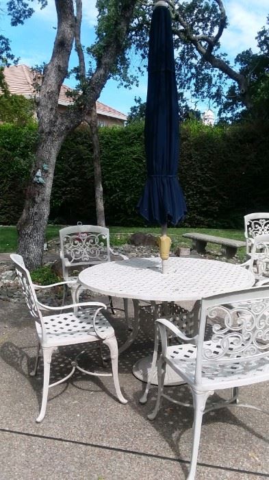 outdoor table set and umbrella 