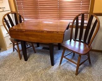 Drop leaf table with 2 chairs. Table measures 42" x 25" with (2) 8-1/2" leafs  