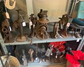 large assortment of antique car jacks