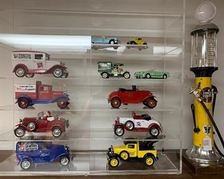 Gas pump alcohol dispenser, plexiglass cabinet, I large assortment of metal diecast banks and cars