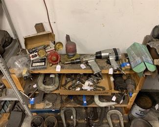 Assortment of clamps, pneumatic tools, and gauges