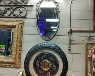 French Beveled & etched oval glass mirror. 
 Hand Carved salvaged furniture crow.
