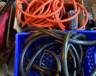 Assorted extension cords and hoses 