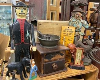 Selection of folk art, advertising pieces and doorstops
