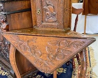 Highly carved drop-leaf corner table
