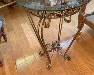 #42	Bronze Painted Glass top Table  15round x 20H	 $30.00 	

