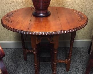 #KH206 Cherry Drop Leaf Table with carving 28"Hx25"Dx11 1/2-33"W $45
