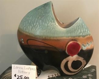 #69	Loren Lukens pottery vase in green red design	 $25.00 		
