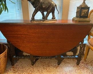 Oval drop leaf table with single drawer