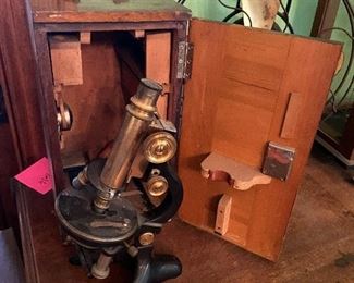Vintage brass and cast iron microscope with wooden box and accessories. Scientific 