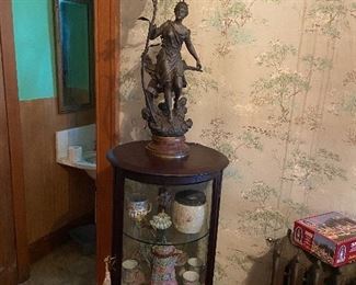 curio and bronze lamp statue 