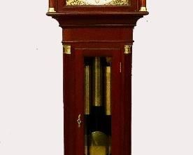 Seth Thomas No. 28 Grandfather Clock - An early 20th century Seth Thomas No. 28 model grandfather clock.  8-day weight driven No. 74 D movement with quarter hour Westminster chime on four bells and a Cathedral gong hour strike, Brass dial with painted Moon phase above a Silvered chapter ring and Gilded Arabic numerals and subsidiary seconds dial flanked by Gilded filigree spandrels with finely engraved decoration.  Mahogany case with molded Swan neck pediment and turned Brass finials above an arched dial door flanked by fluted columns with Brass capitols and bases over a waist door with thick beveled glass flanked by fluted quarter columns with Brass capitols and bases, all on a paneled base supported by OGEE bracket feet.  Restored finish with only slight wear, movement recently overhauled, running and striking correctly when cataloged.  21 1/2 x 15 x 97 1/2" high overall.  ESTIMATE $3,000-5,000
