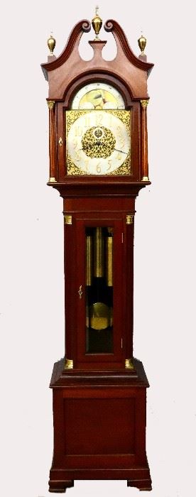 Seth Thomas No. 28 Grandfather Clock - An early 20th century Seth Thomas No. 28 model grandfather clock.  8-day weight driven No. 74 D movement with quarter hour Westminster chime on four bells and a Cathedral gong hour strike, Brass dial with painted Moon phase above a Silvered chapter ring and Gilded Arabic numerals and subsidiary seconds dial flanked by Gilded filigree spandrels with finely engraved decoration.  Mahogany case with molded Swan neck pediment and turned Brass finials above an arched dial door flanked by fluted columns with Brass capitols and bases over a waist door with thick beveled glass flanked by fluted quarter columns with Brass capitols and bases, all on a paneled base supported by OGEE bracket feet.  Restored finish with only slight wear, movement recently overhauled, running and striking correctly when cataloged.  21 1/2 x 15 x 97 1/2" high overall.  ESTIMATE $3,000-5,000
