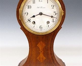 Seth Thomas Parma Mantle Clock - An early 20th century Seth Thomas "Parma" model mantle clock.  8-day time and strike movement with porcelain dial and Arabic numerals.  Balloon form Mahogany case with inlaid detail, Brass bezel and feet.  Refinished case with some wear and filled repairs, hairlines and edge damage to dial, running when cataloged.  12 1/4" high.  ESTIMATE $100-200
