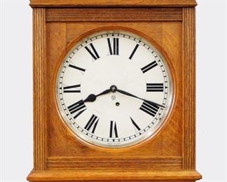 Ansonia Foyer No. 4 Model Gallery Clock - A late 19th century Ansonia "Foyer No. 4" model gallery clock.  8-day time with painted metal dial and Roman numerals.  Oak case with flat topped over a single door with reeded moldings and shaped drop.  Older refinishing, lacks crown, some dial wear, running when cataloged.  21 1/2" high.  ESTIMATE $200-300