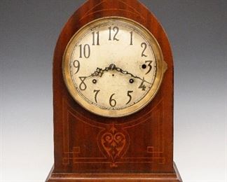 Seth Thomas No. 266 Sonora Chime Mantle Clock - An early 20th century Seth Thomas "No. 266" model 8-bell Sonora chime mantel clock.  8-day time and strike #104A movement with quarter hour striking on eight Sonora bells in either Whittington or Westminster Cathedral chimes, convex Silvered dial with applied Arabic numerals.  Mahogany case with arched top and inlaid detail having a Brass dial door with convex beveled glass on a molded base.  Restored finish with minor wear, some dial wear, running when cataloged.  18 1/4" high.  ESTIMATE $1,000-2,000

