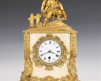 French Bronze &  Marble Mantle Clock - A late 18th century French Bronze and Marble figural mantle clock by Pierre Robinot, Paris.  8-day time only movement with silk thread suspension and porcelain dial with Roman numerals.  Marble case with Bronze mounts including a figure of a French Explorer, possibly Robert de la Salle above an elaborate scrolled foliate bezel and base.  Some wear and minor damage to the marble, small dial flakes at winding arbor, running when cataloged.  16 1/2" high.  ESTIMATE $800-1,200


