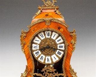 F H S Louis XVI Style Bracket Clock - A late 20th century Louis XVI style bracket clock by Franz Hermle & Sohn, Gosheim, Germany.  8-day time and strike movement on two bells with cast dial and Roman numeral plaques.  Shaped case with inlaid floral design, Bronze mounts and scrolled feet with foliate detail.  Original finish with only slight wear, running when cataloged.  22 1/4" high.