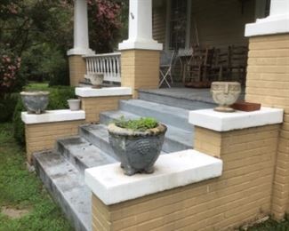 Pair of large and pair of smaller concrete planters sold in pairs