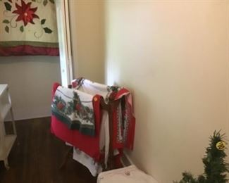 Christmas linen located in school house. There are placemats, table cloths, napkins, etc