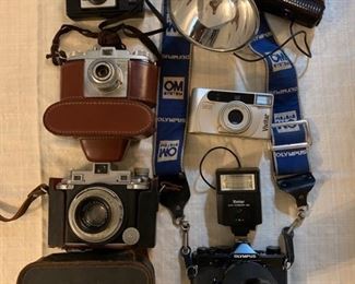 Collection of vintage cameras plus accessories not pictured.
