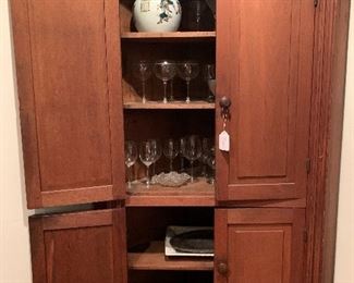 Mid to late-1800s corner cupboard. $850