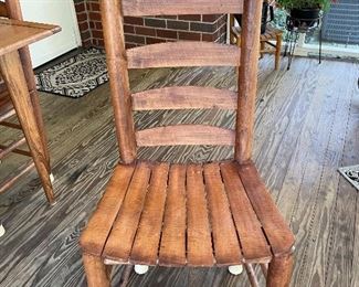 Rough hewn wooden chair that accompanies dining table