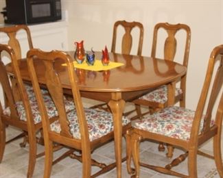 Dining table, 6 chairs and extra leaves.