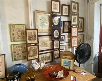 gallery wall of antique framed prints