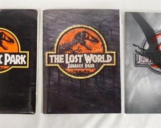 1016 LOT OF JURASIC PARK MOVIE MEMORBILIA. LOT INCLUDES A PRESS KIT FOR JURASSIC PARK; CONTAINS 9 STILLS, PRODUCTION INFO, A SCREENING INVITATION & 7 35MM SLIDES. PRESS KIT FOR JURASSIC WORLD; CONTAINS 9 STILLS PRODUCTION INFO, & A SCREENING INVITATION, LOT ALSO INCLUDES A MOVIE POSTER & A POSTCARD SET. & JURASSIC PARK III PRESS KIT; CONTAINS 6 STILLS, A DINOSAUR SIZE CHART & PRODUCTION INFO.